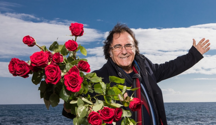 Foto di Al Bano con un mazzo di rose rosse